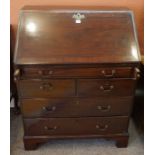 A Mahogany Writing Bureau, circa 19th century, Having a fall front enclosing fitted drawers and