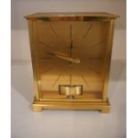A Jaeger Le Coultre Atmos Clock, Possibly a Marina design, Having a gilded dial with black baton