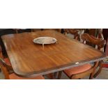 A Mahogany Supper Table, circa early 19th century, The snap action top having canted corners, with