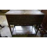 A Carved Oak Side Cabinet, circa early 20th century, Having two small drawers above a long drawer