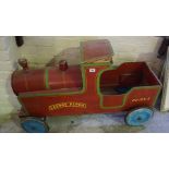 A Model Train "Leeway Flyer", circa 1950s, painted in red, PE 125-7, raised on wheels, 62cm high,