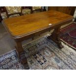 A Victorian Mahogany Dumb Waiter, Having an extending rectangular top, raised on square columns