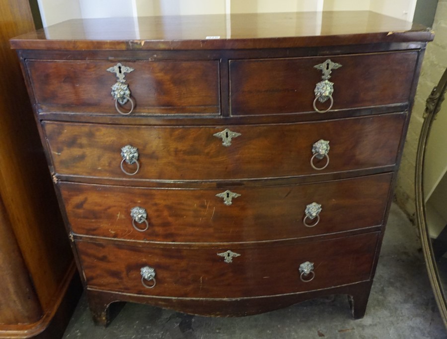 A Georgian Mahogany Bow Front Chest of Drawers, Having two small drawers above three long drawers,