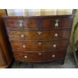 A Georgian Mahogany Bow Front Chest of Drawers, Having two small drawers above three long drawers,