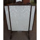 A Victorian Mahogany Firescreen, In the style of Gillows, Having a pull out extending panel to