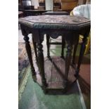 A Jacobean Revival Carved Oak Octagonal Table, Raised on eight column supports, 70cm high, 61cm