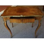 A French Louis XV Style Kingwood Writing Table, circa late 19th century, Having a tooled tan leather