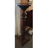A Victorian Stained Mahogany Torchere, Having a circular top, raised on a baluster column and square