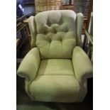 An Electric Relaxer / Massage Recliner Armchair, Upholstered in a beige fabric, with electric