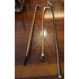 Three Walking Sticks, with stag antler handles, one example having a screw off handle, 90cm,