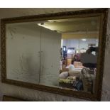 A Modern Gilt Framed Wall Mirror, The mirror is decorated with panels of swans, 70cm high, 100cm