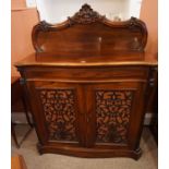 A Victorian Rosewood Chiffonier, Having a carved pediment, above a large drawer and two cupboard