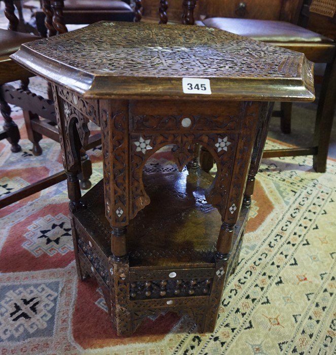 A Burmese Carved Octagonal Table, circa early 20th century, Decorated with mother of pearl roundels,