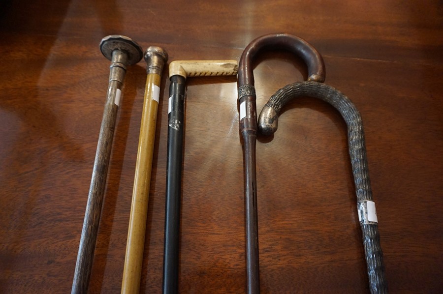 Five Assorted Walking Sticks, circa early 20th century, to include two with silver tops and two with - Image 2 of 2