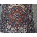 A Persian Style Rug, 20th century, Decorated with allover floral panels on a cream ground, with blue