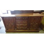 A Victorian Style Mahogany Sideboard, Having four graduated drawers to the centre, flanked with a