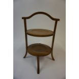 An Edwardian Mahogany Table Cake Stand, having two tiers, 42cm high