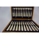 A Set of Twelve Silver Plated and Mother of Pearl Fruit Knives and Forks, In a fitted box