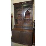 A Gillows Style Mahogany Bookcase, circa 19th century, Having two glazed astragal doors enclosing