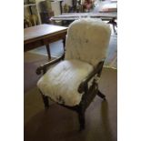 A Regency Mahogany Library Armchair, circa early 19th century, raised on carved legs with brass