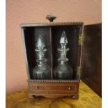 A Georgian Style Mahogany Inlaid Decanter Box, Enclosing two similar 19th century glass decanters,