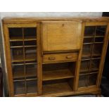 An Oak Secretaire Display Cabinet, circa 1930s, Having a fall front enclosing pigeon holes,