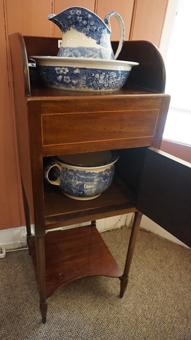 A Mahogany Washstand, circa 19th century, Having a fitted open top above a door, enclosing four