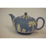 A Wedgwood Jasperware Blue and White Tea Pot, 13cm high, also with a large Denby stoneware jug,