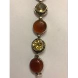 A Scottish Silver Mounted Flexible Bracelet, Set with four carnelian style cabochons and three