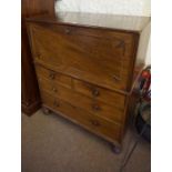 A Georgian Mahogany Campaign Chest, Having a fall front enclosing a later leather tooled surface,