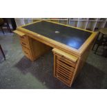 A Vintage Golden Oak Desk, Having two slides to the top, above three garduated drawers, flanked with