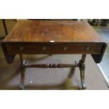 A Victorian Mahogany Sofa Table, Having two drawers with opposing faux drawers, drop ends, raised on