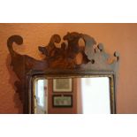 A Regency Style Walnut Fretwork Wall Mirror, 80cm high, 46cm wide