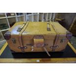 A Vintage Travel Trunk, Having brass and leather fittings, with a hinged top enclosing a canvas