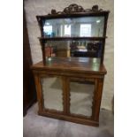 A Rosewood Chiffonier, circa early 19th century, Having a mirror back with open shelve, above two