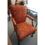 A Pair of Chippendale Style Mahogany Armchairs, Upholstered in red floral damask, raised on ball and