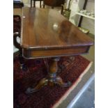 A Victorian Rosewood Library Table, Having a plain rectangular top with canted corners, raised on