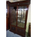 A Mahogany Cabinet by Hobbs of London, circa late 19th century, Having two glazed astragal doors,