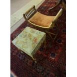 A Victorian Walnut Stool, having a needlepoint top, raised on turned legs, 45cm high, 36cm wide,