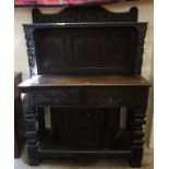 A William and Mary Style Oak Court Cupboard, Decorated with carved diamond shaped lozenges, and mask