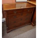 A George III Mahogany Chest of Drawers, Having two small drawers above three long drawers, raised on