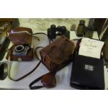 A Mixed Lot of Vintage Cameras and Field Glasses, To include a Kodak cine camera, model 20, in