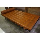 A Retro Style Day Bed, Having a tan coloured button back seat, with a matching rolled cushion, 196cm