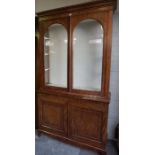 A Victorian Mahogany Bijouterie Style Cabinet, Having two large glazed doors, above two cupboard