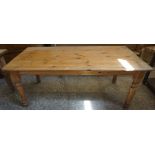 A Pine Refectory Table, Having a rectangular plank top, raised on turned legs, 74cm high, 184cm