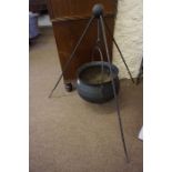 An Antique Style Iron Cauldron / Cooking Pot, Having a swing handle, approximately 50cm high, raised
