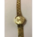 A 9ct Gold Ladies Wristwatch by Tatton, Having a silvered dial with baton numerals, on a flexible