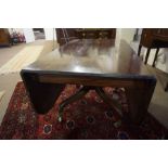 A Regency Design Mahogany Dining Table, circa 19th century, Having two extending drop sides, with