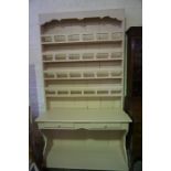 An Antique French Painted Pine Kitchen Dresser, Having four plate shelves, above two small
