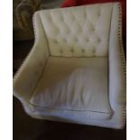 A Modern Button Back Armchair, Upholstered in cream fabric, 84cm high